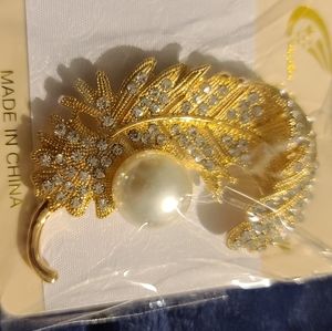 Gold-tone crystal feather broach lapel pin